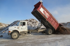 Parker bringing in a load of horse manure this week.